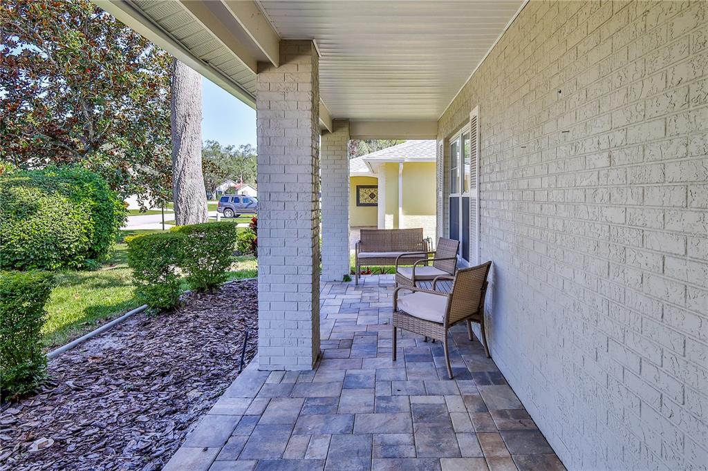 6428 Plantation Road Spring Hill, FL 34606 - Photo 5 of 50 a view of a patio with a table and chairs