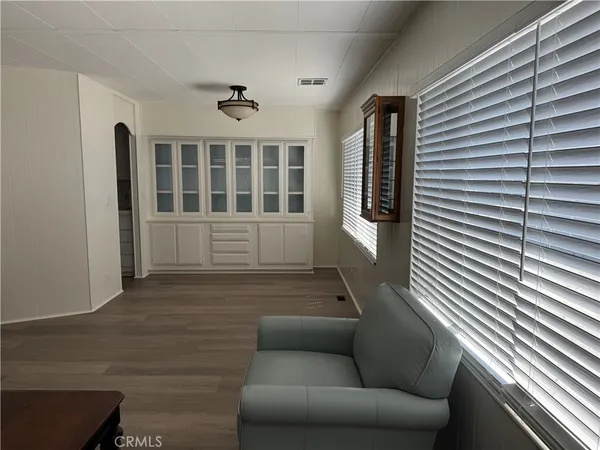 a view of livingroom with furniture wooden floor and windows
