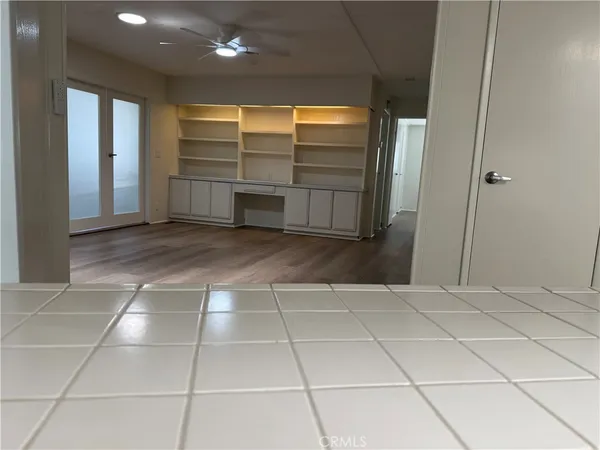 a view of an empty room with a fireplace