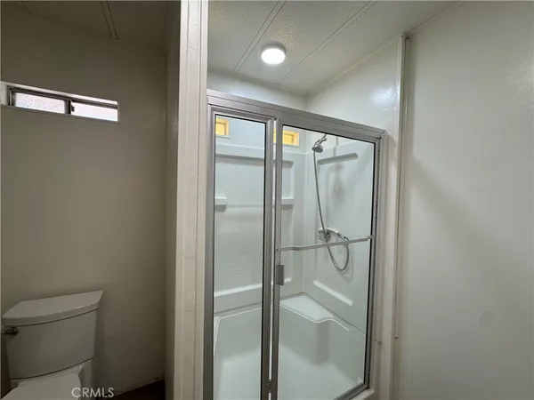 a bathroom with a granite countertop sink and mirror