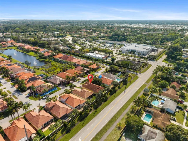 an aerial view of residential houses with outdoor space
