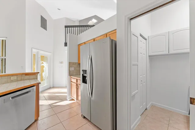 a bathroom with a shower and a sink