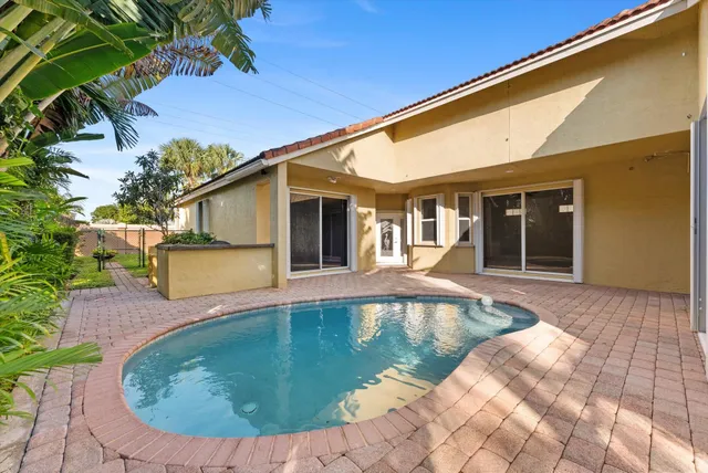a view of a house with swimming pool