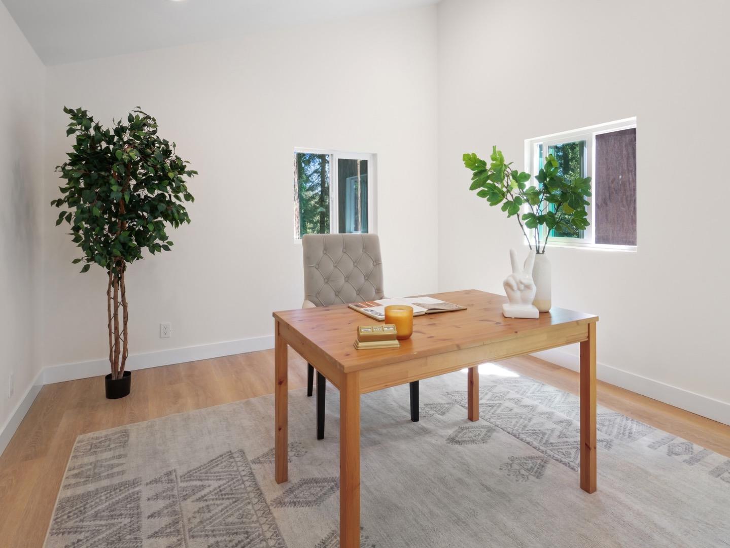 1495 McLellan Road Felton, CA 95018 - Photo 17 of 20 a view of a workspace with a table and chair in a room