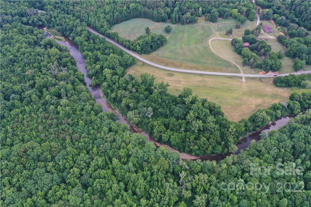 7700 Edgefield Road Concord, NC 28025 - Photo 19 of 48 an aerial view of a house with a yard and outdoor seating