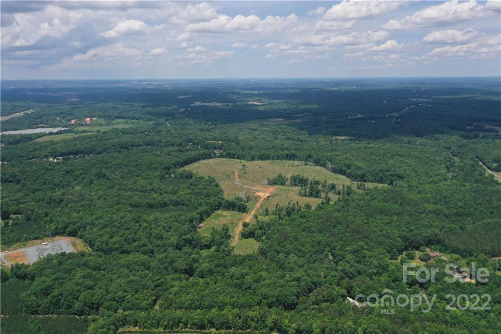 7700 Edgefield Road Concord, NC 28025 - Photo 8 of 48 an aerial view of residential houses with outdoor space and trees