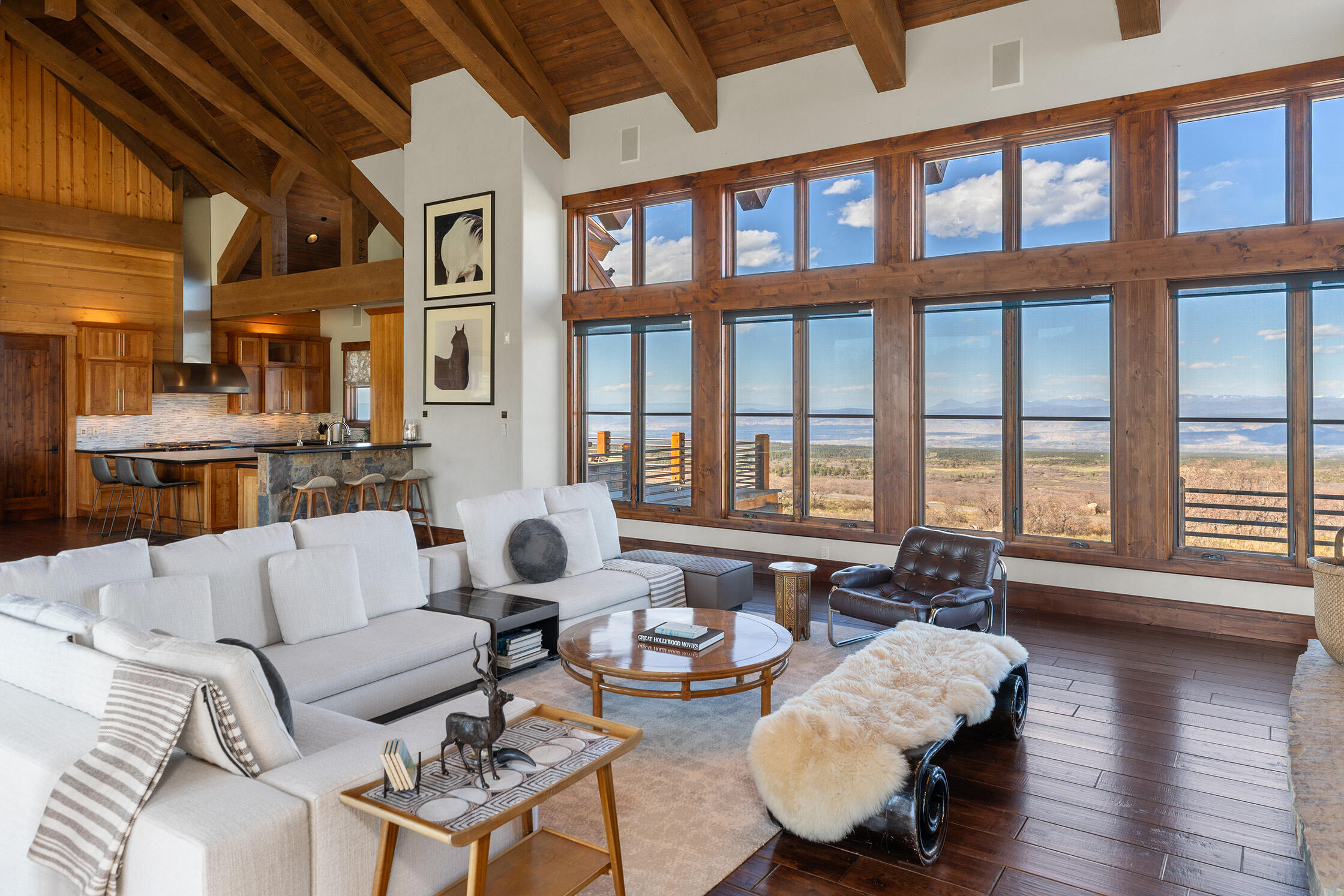 1221 Cornerstone Loop Montrose, CO 81403 - Photo 5 of 44 a living room with furniture and floor to ceiling windows