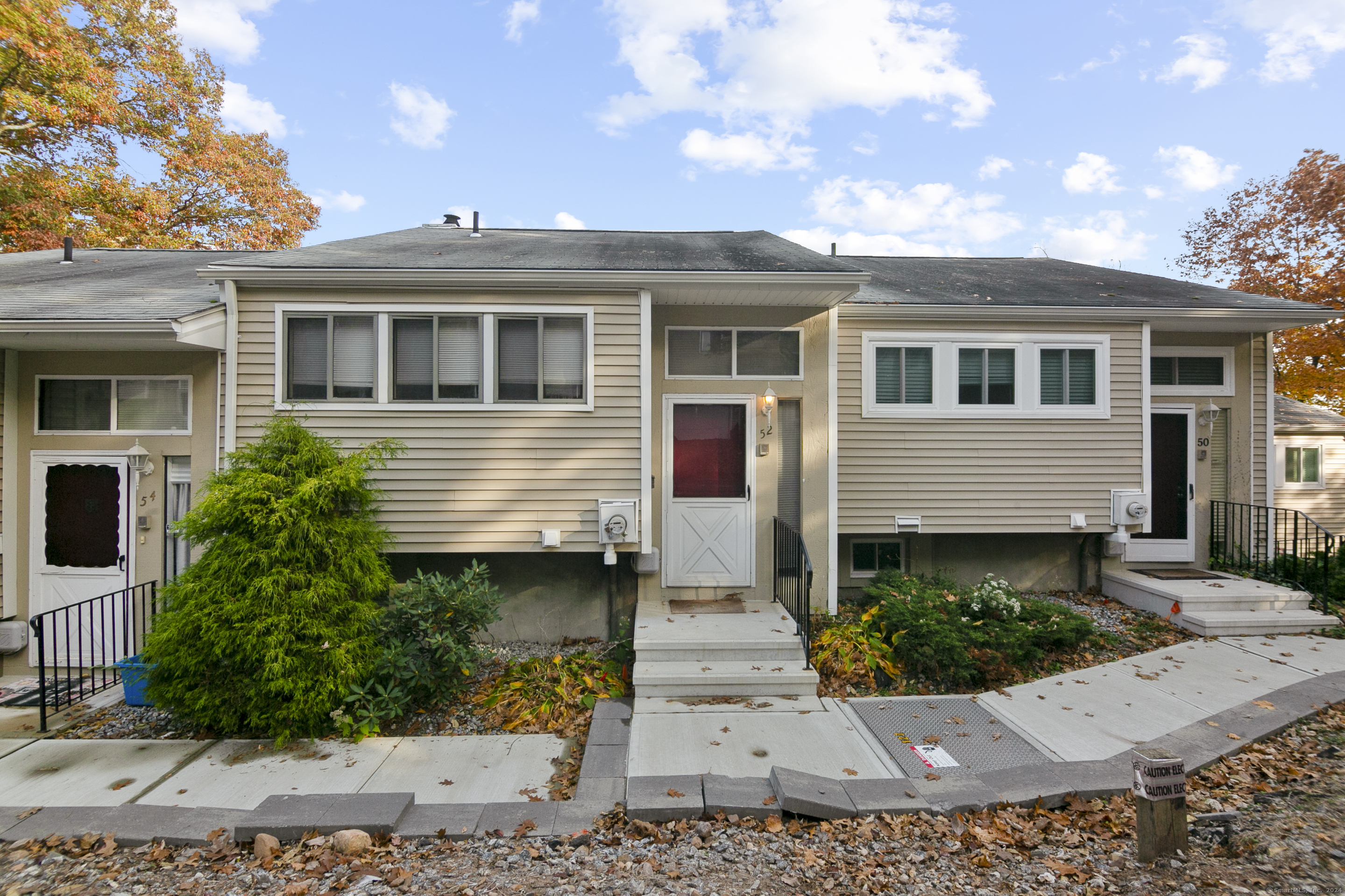 52 Shepard Avenue, Unit 52 Hamden, CT 06514 - Photo 1 of 1 a front view of a house with a yard and potted plants