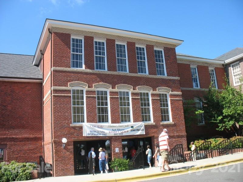 314 Sadie Drive Matthews, NC 28105 - Photo 6 of 13 a front view of a building with a garden