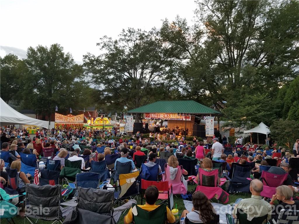 314 Sadie Drive Matthews, NC 28105 - Photo 9 of 13 a group of people standing around a fruit