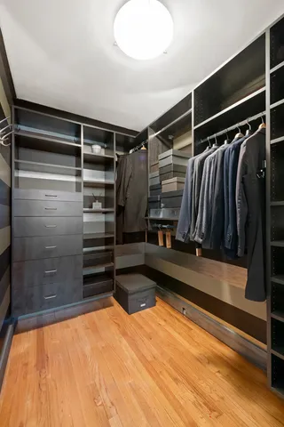 a bathroom with a sink a toilet and a large mirror