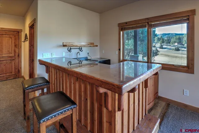 a kitchen with sink cabinets and window