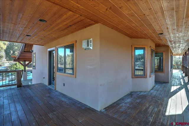a view of livingroom with hardwood floor and a garden