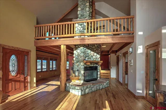 a view of livingroom with furniture wooden floor and a fireplace