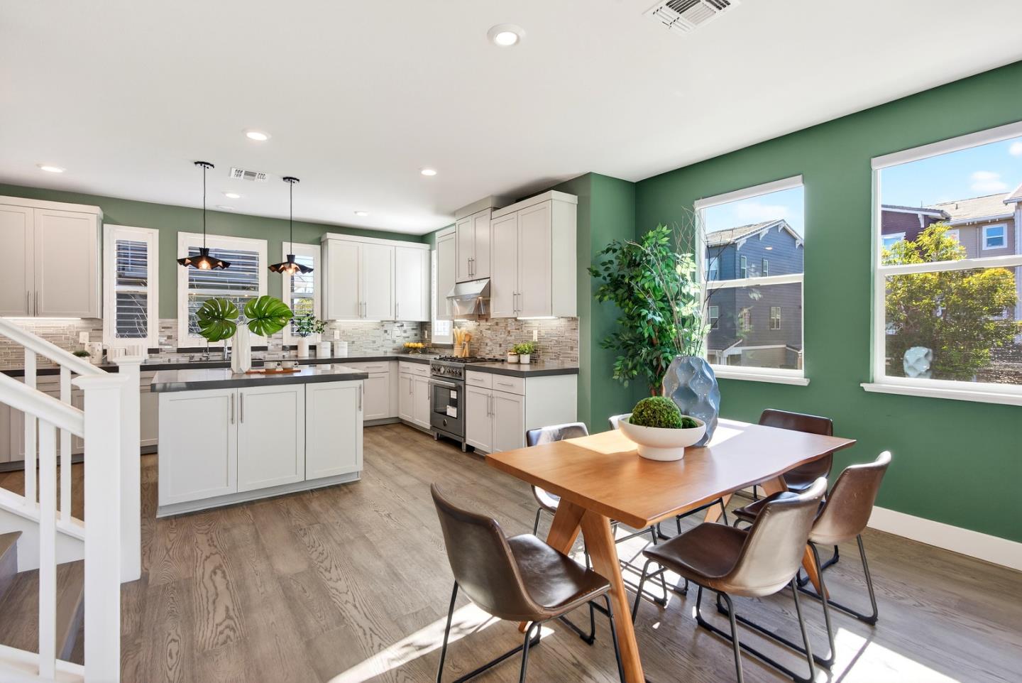 2268 Mora Place Mountain View, CA 94040 - Photo 12 of 38 a kitchen with a table chairs microwave and cabinets