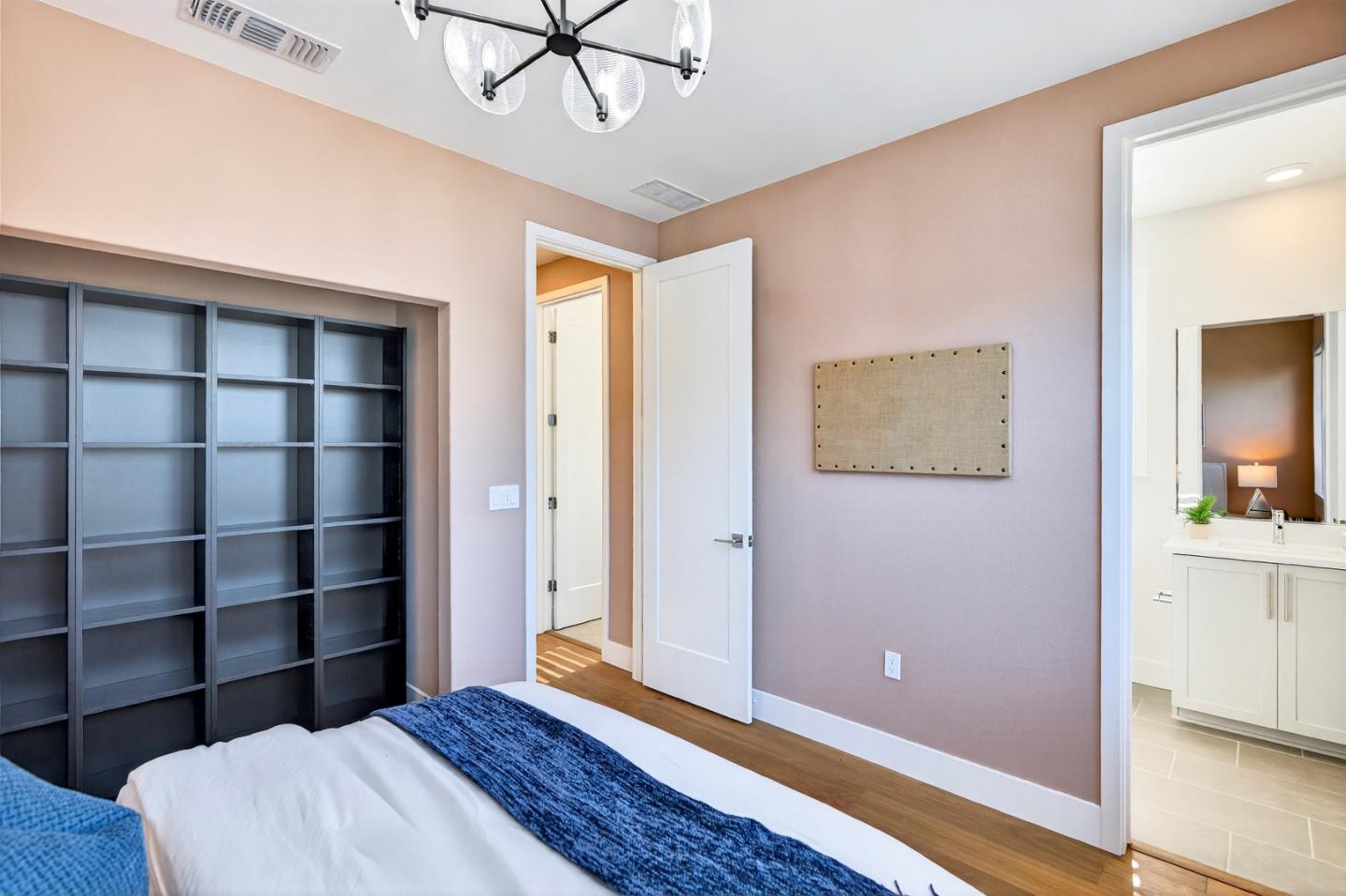 2268 Mora Place Mountain View, CA 94040 - Photo 28 of 38 a bedroom with a bed and a chandelier