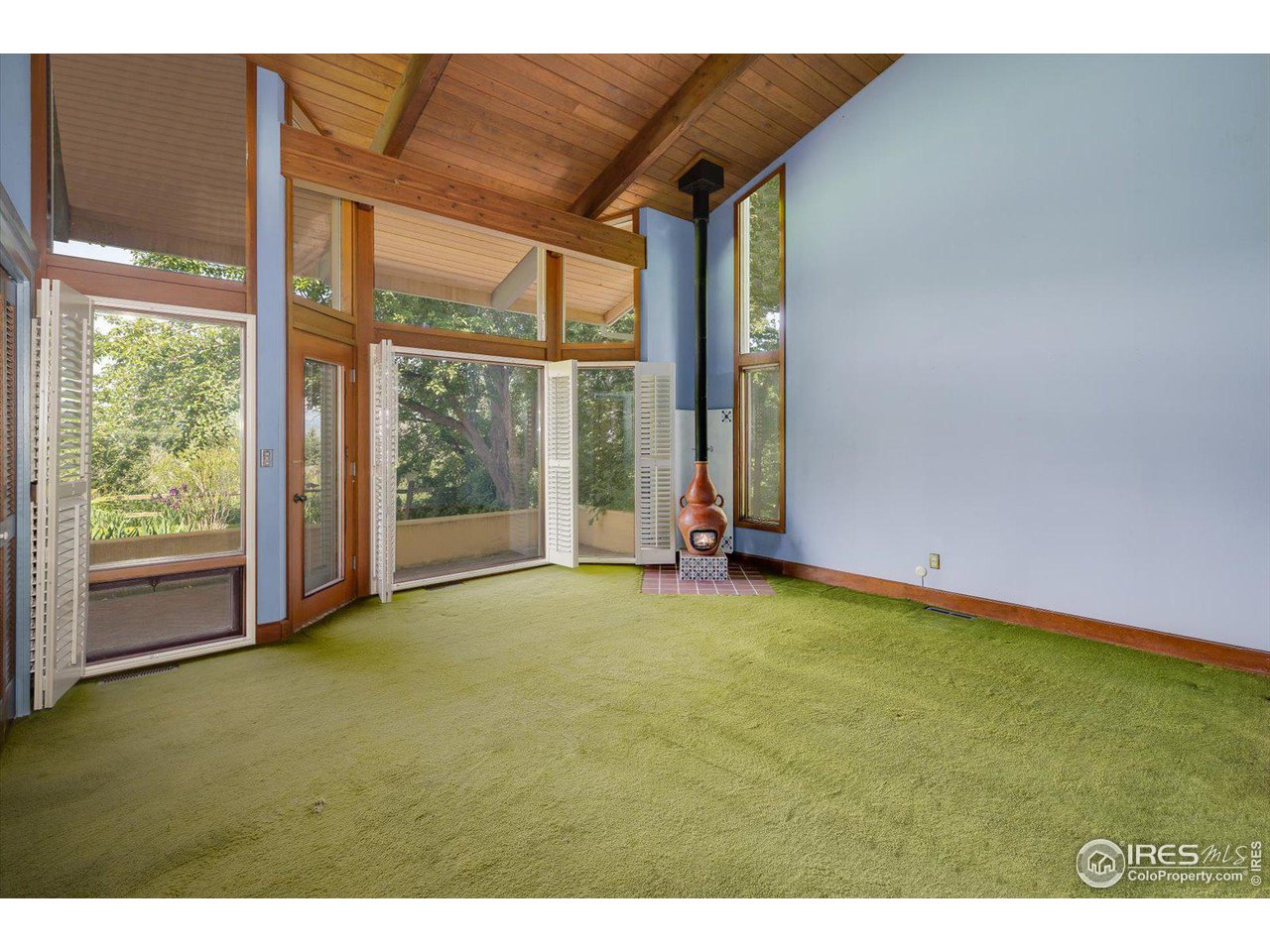400 Ord Drive Boulder, CO 80303 - Photo 22 of 39 Primary bedroom w/ fireplace & door out to front patio