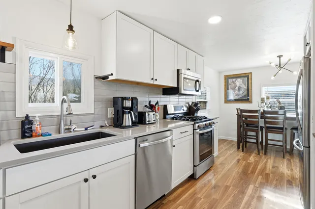 a kitchen with a stove and a microwave