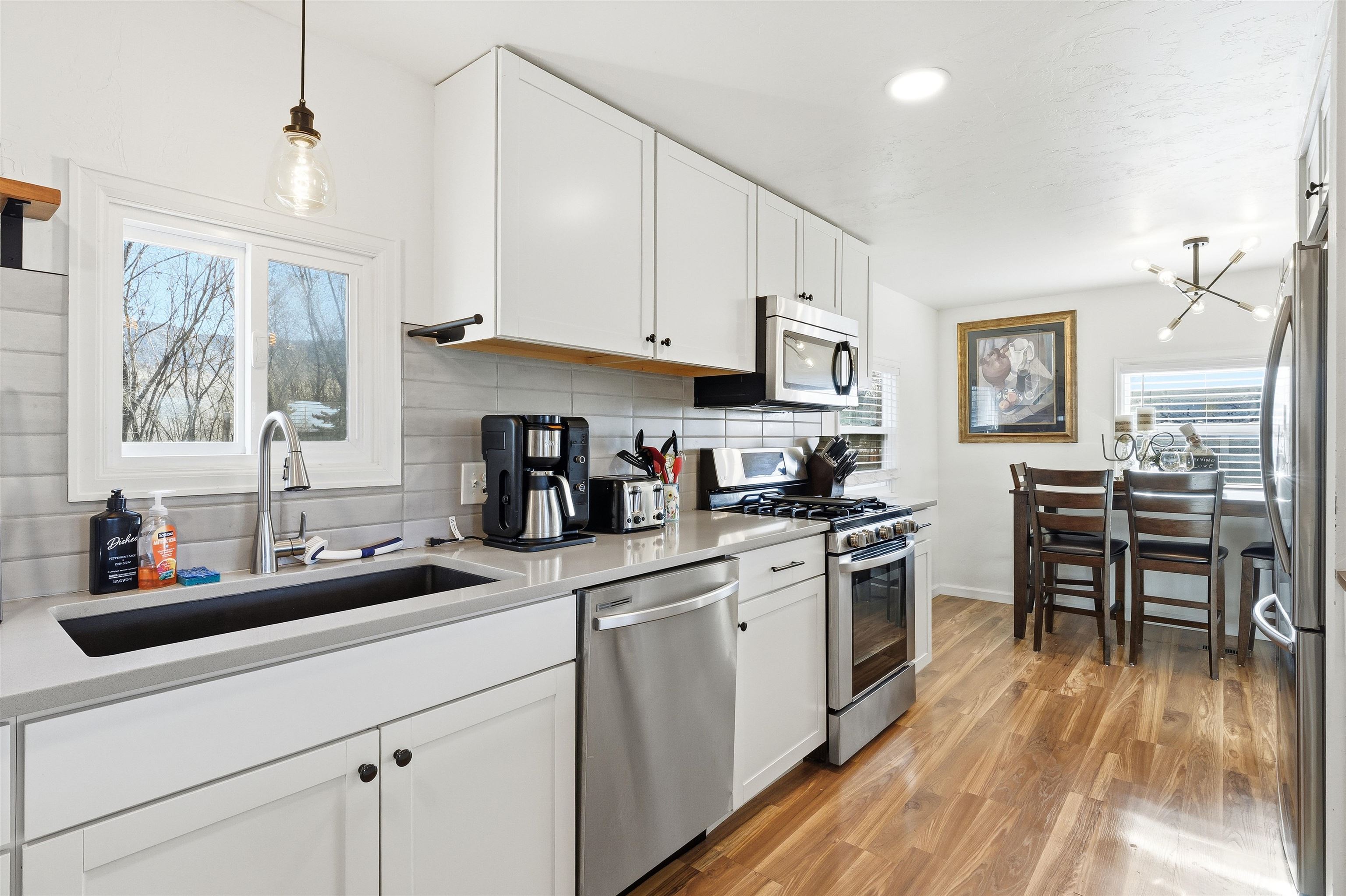 702-37 37 1/10 Road Palisade, CO 81526 - Photo 15 of 42 a kitchen with stainless steel appliances granite countertop a sink a stove and cabinets