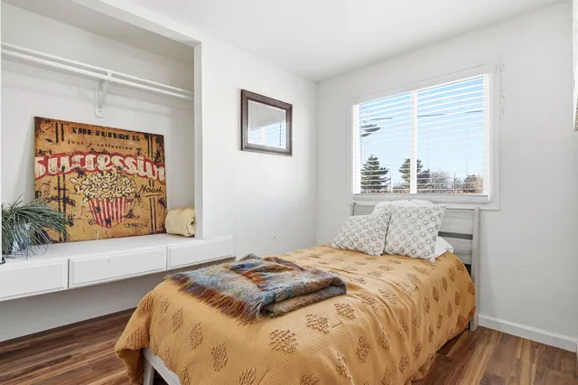 a bedroom with a bed and cabinets