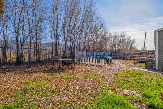 a view of a swimming pool with sitting area and garden