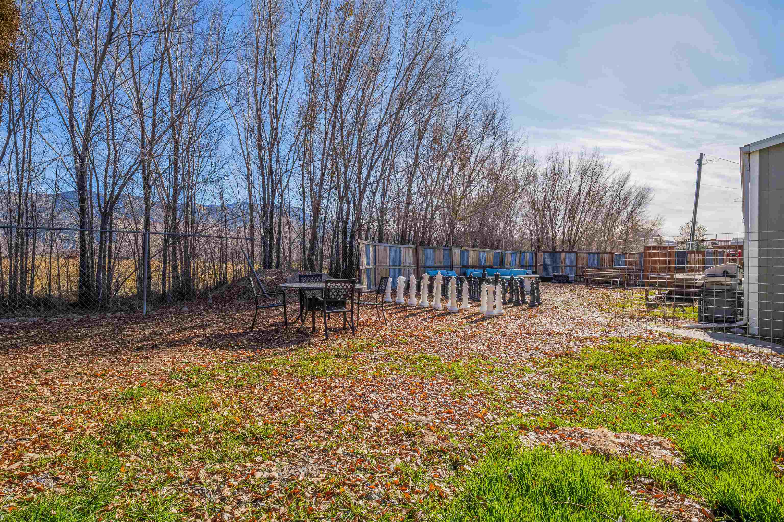 702-37 37 1/10 Road Palisade, CO 81526 - Photo 3 of 42 a view of a swimming pool with sitting area and garden