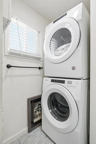 a bedroom with a bed and a wall painting