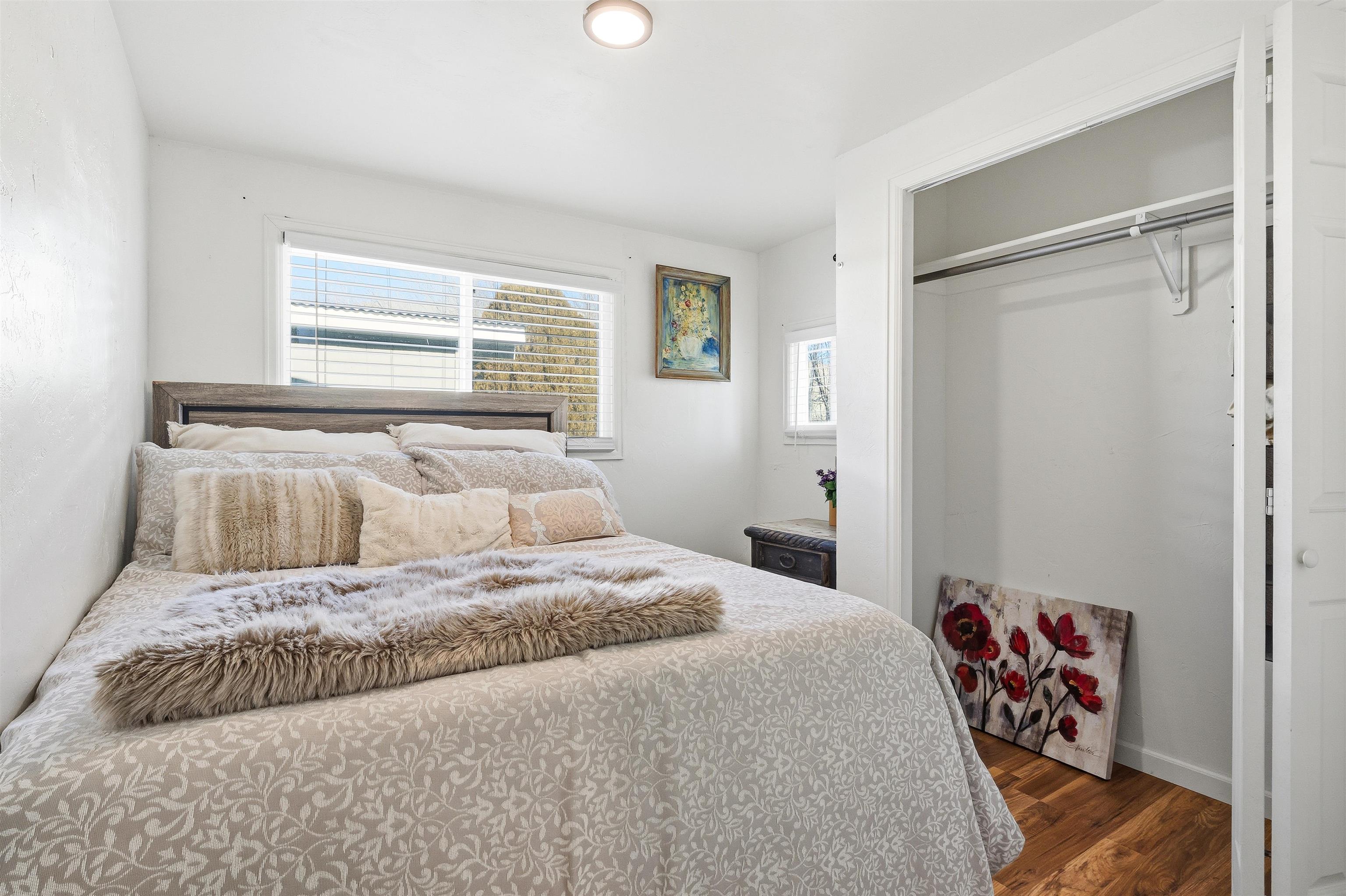 702-37 37 1/10 Road Palisade, CO 81526 - Photo 34 of 42 a bedroom with a large bed and a window