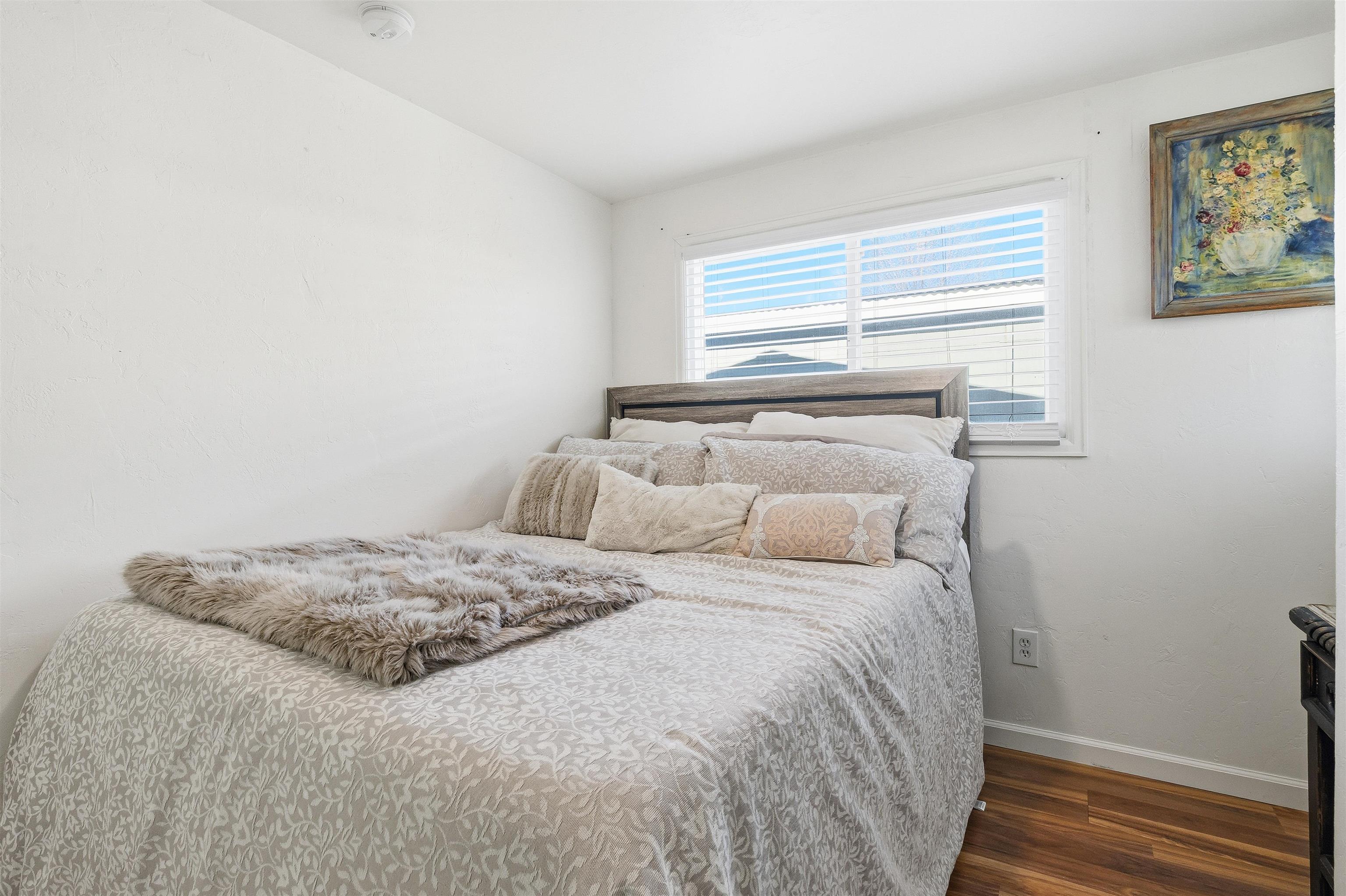 702-37 37 1/10 Road Palisade, CO 81526 - Photo 35 of 42 a bedroom with a bed and a window