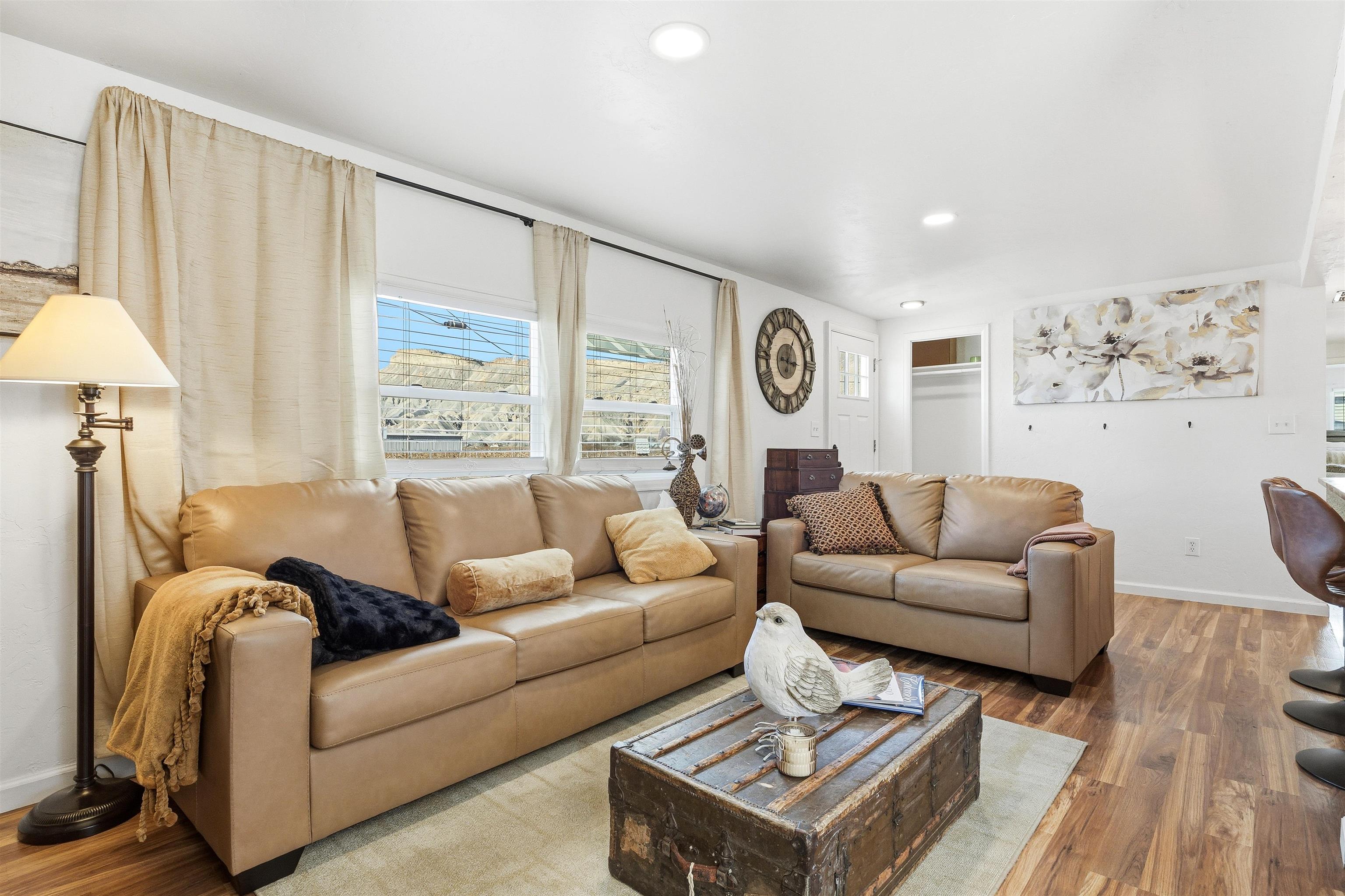 702-37 37 1/10 Road Palisade, CO 81526 - Photo 9 of 42 a living room with furniture and a large window