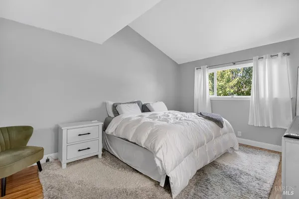 a view of a hallway with a wooden floor