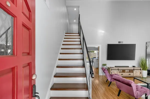 a bed room with a bed and a flat tv screen