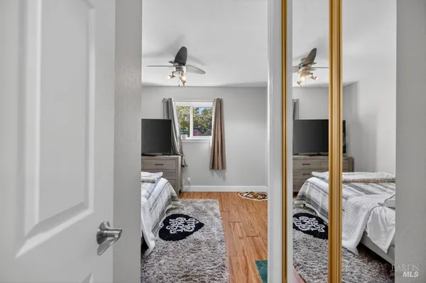 a view of a backyard with wooden fence