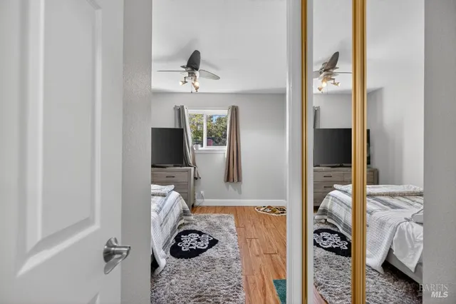 a view of a backyard with wooden fence