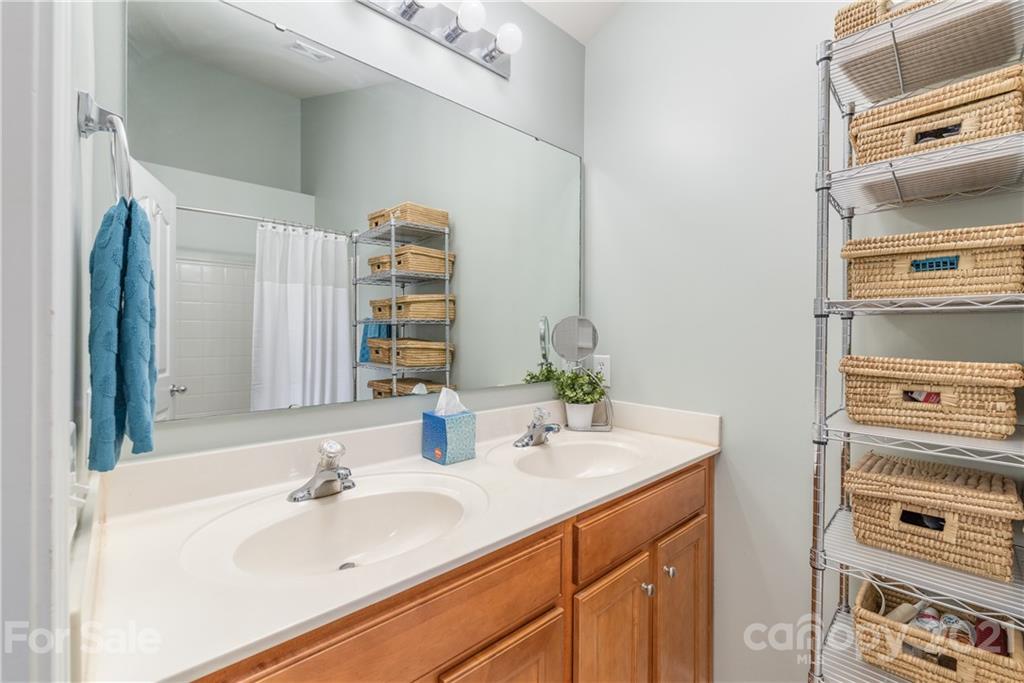 1131 Market Street Fort Mill, SC 29708 - Photo 13 of 27 a bathroom with a sink and a mirror