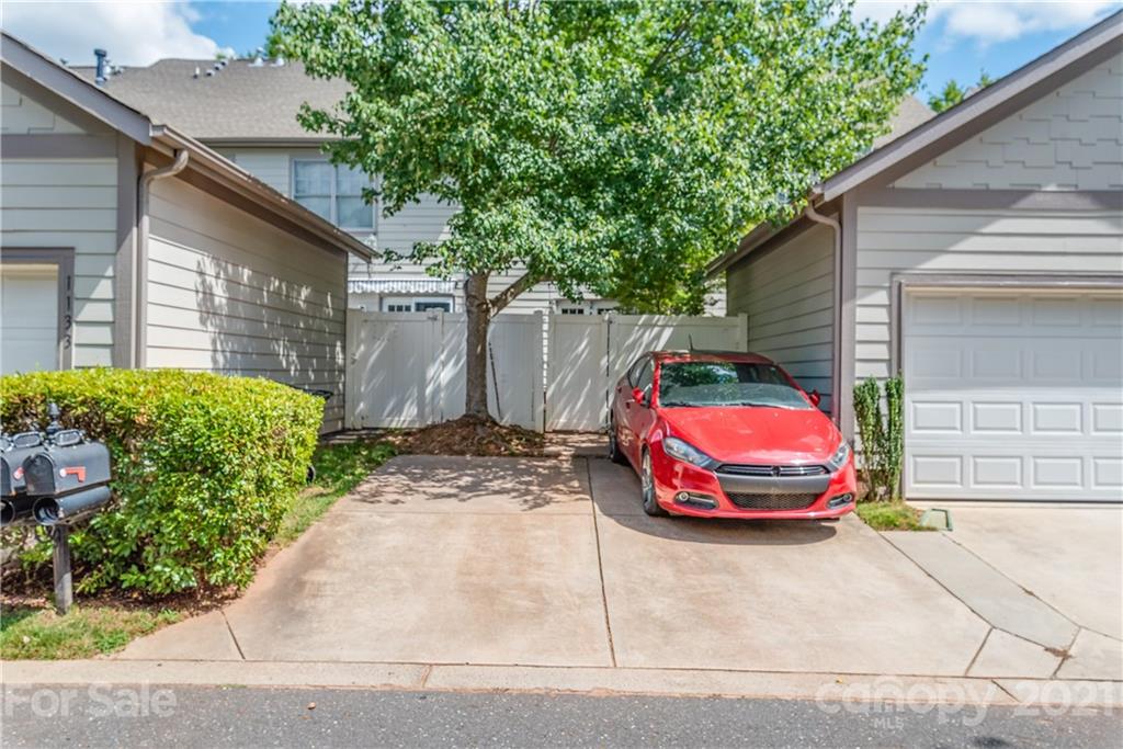 1131 Market Street Fort Mill, SC 29708 - Photo 19 of 27 a view of a small house with cars parked