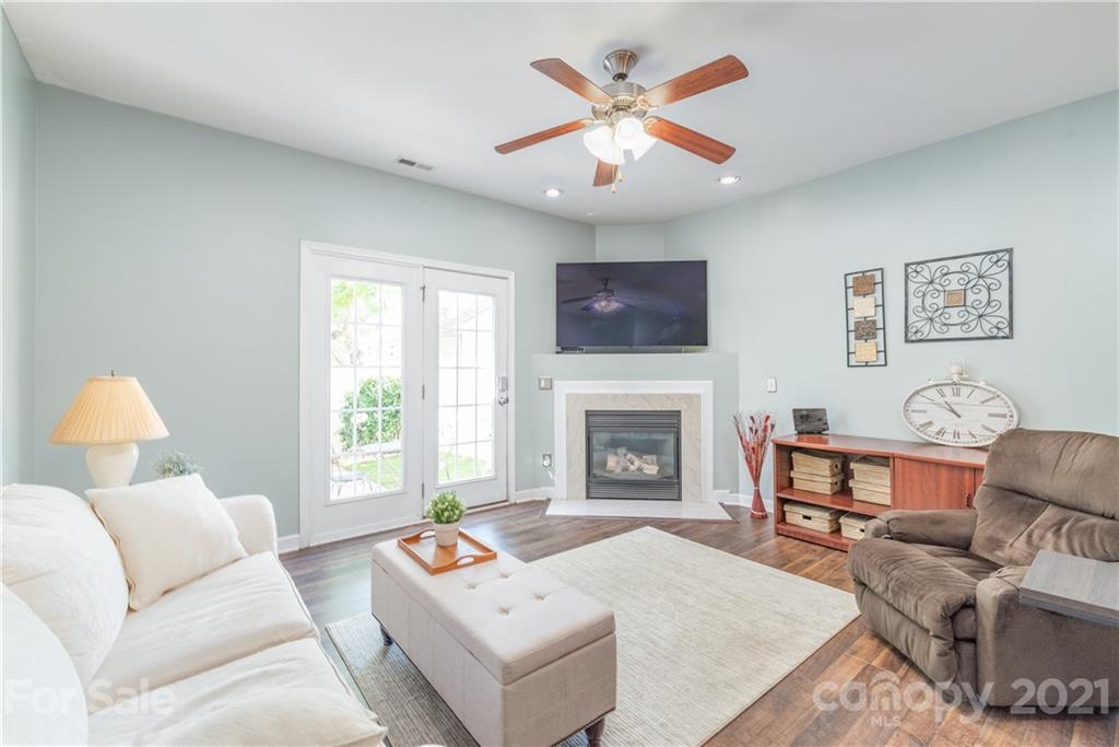 1131 Market Street Fort Mill, SC 29708 - Photo 9 of 27 a living room with furniture a fireplace and a flat screen tv