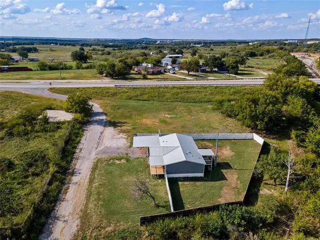 an aerial view of a houses with outdoor space