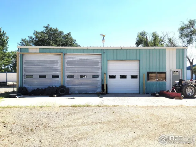 a view of a house with snow in the background