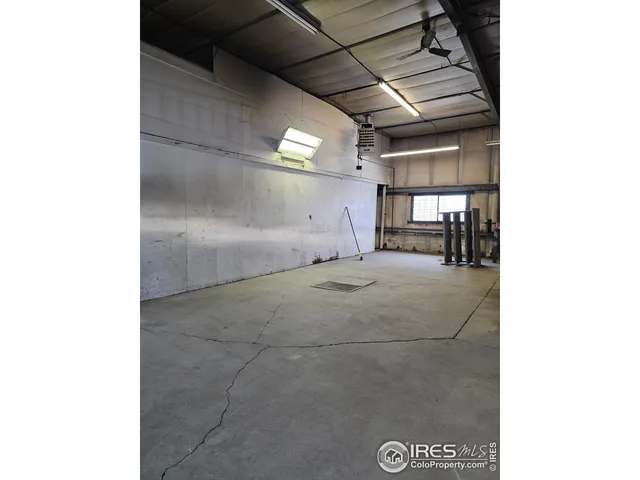 a view of storage and utility room with two windows