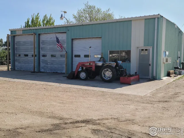 a black car parked in front of house