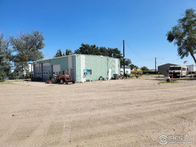 a view of an empty room with a window and a mirror
