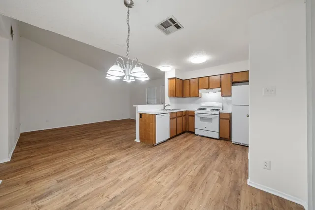 a view of a backyard with large trees