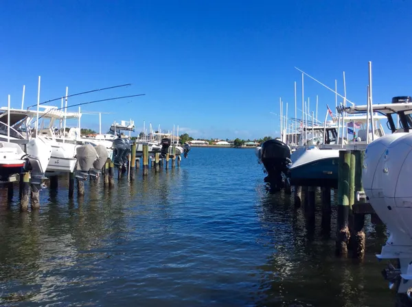 a dining room with furniture water view and kitchen view
