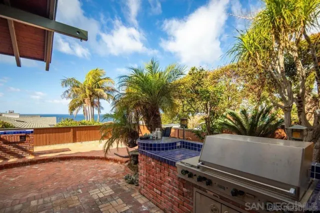 a view of a backyard with sitting area
