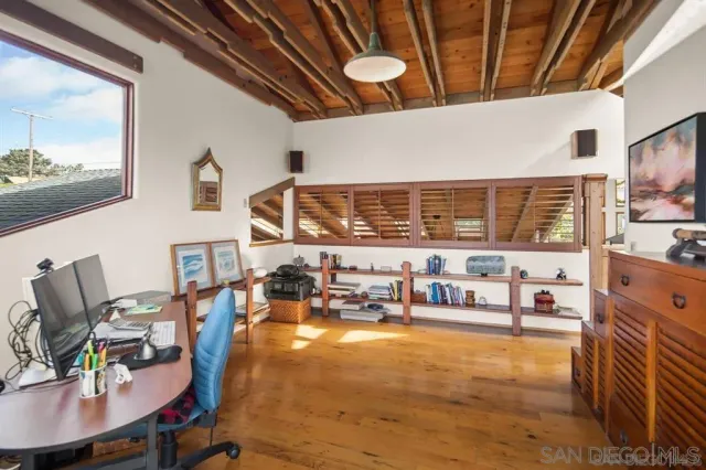a view of a chairs and table on the wooden floor