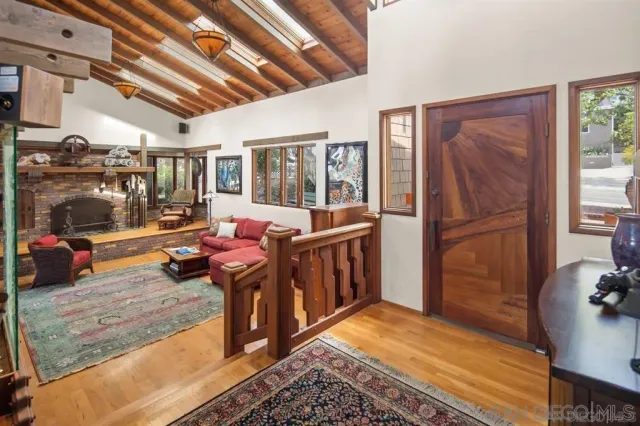 a living room with furniture stove and a refrigerator