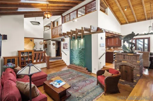 a view of a patio with couches chairs and a fire pit