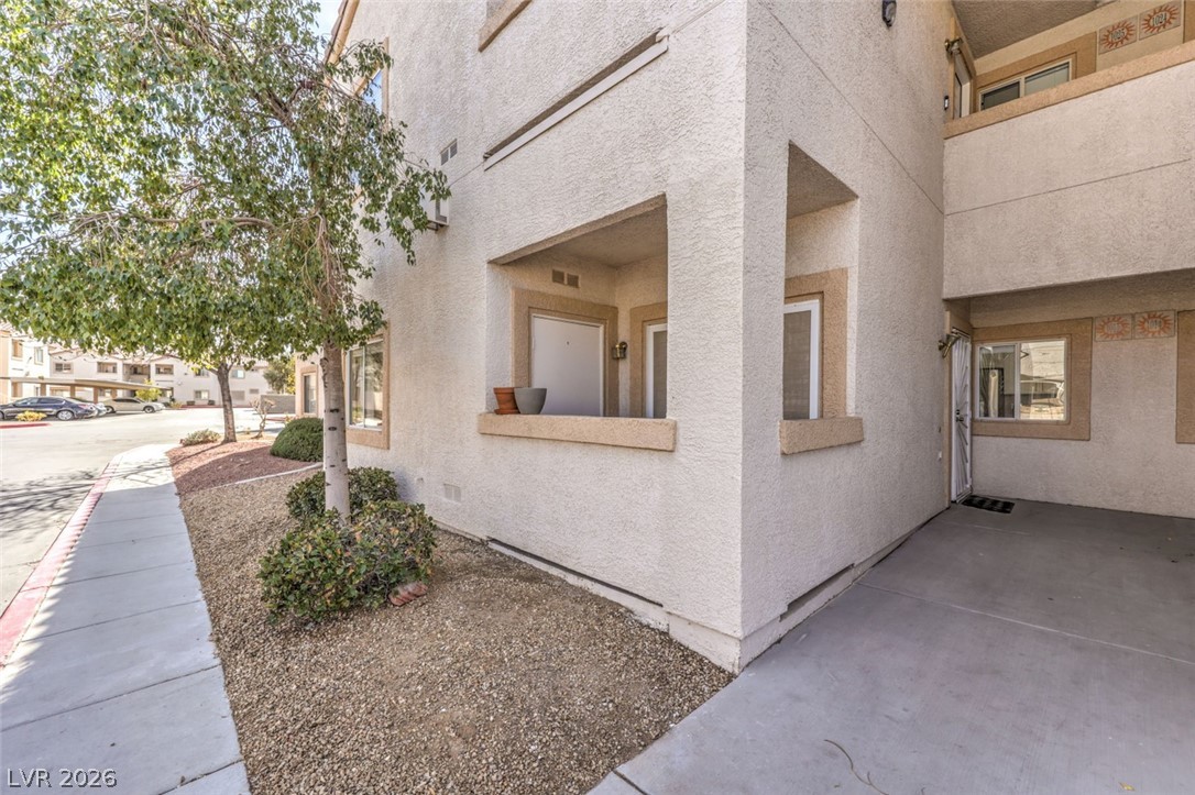 855 North Stephanie Street, Unit 1015 Henderson, NV 89014 - Photo 1 of 27 View of home's exterior with stucco siding