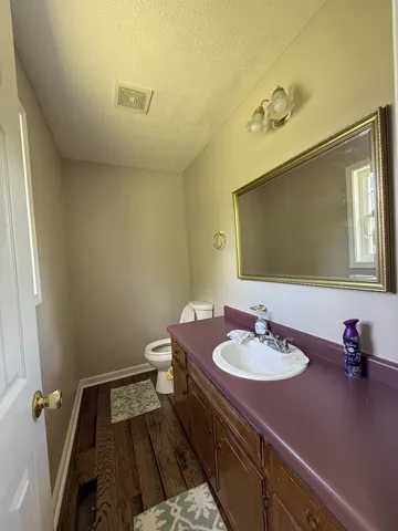 a bathroom with a sink double vanity and a mirror